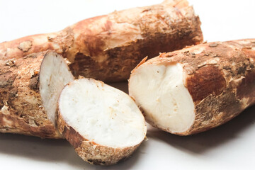 close up of raw cassava pieces isolated on white background