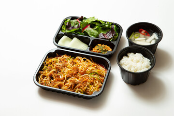 Take-out lunch box, spicy stir-fried meat and side dishes