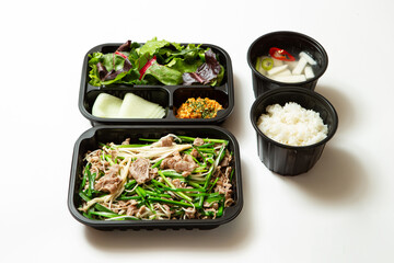 Stir-fried meat and side dishes in packaging containers, Korean food