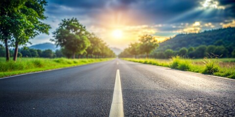 Fototapeta premium Rural Road Blur: A blurred rural road with asphalt, providing a serene and countryside feel for product displays. 