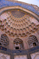 The inside of a building with a blue and white color scheme. The building has a lot of arches and a dome