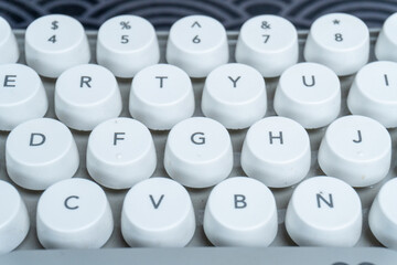 high angle close up of white keyboard button