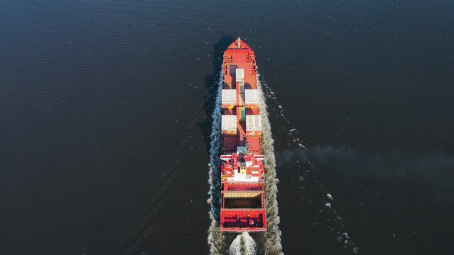 Easy load container ship underway on the sea for logistic import export or transportation, Crisis global trade, aerial video