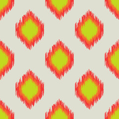 Abstract bright red and green rhombuses with jagged edges on a light gray background form a seamless pattern for modern textiles, wrapping paper, decorative pillows. 