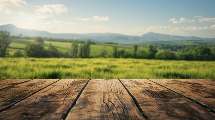 Wooden tabletop with a blurred background of scenic green fields under a clear sky