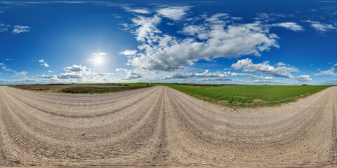 blue sky hdri 360 panorama with awesome clouds on gravel road among fields in spring day in equirectangular full seamless spherical projection, for VR AR content or skydome replacement © hiv360