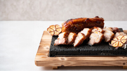 Oven-baked meat on a stone plate