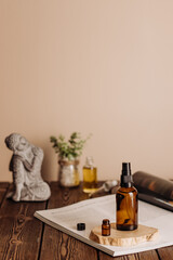 One cosmetic dark amber glass bottle on wooden table. Closeup, copyspace. Beauty blogging, salon treatment spa concept, minimalism brand packaging mock up