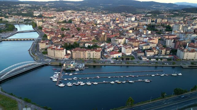 Aerial view of Spanish Galician city PONTEVEDRA. View of old town center with historic buildings. Cathedral of Pontevedra. River Lerez crossing the city. Famous travel destination. Static footage