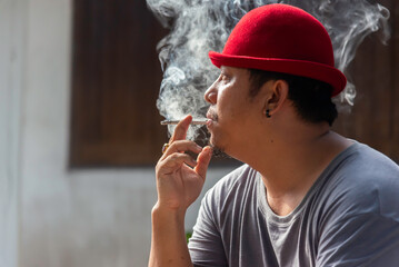 Close up man smoking cigarette.healthcare concept.