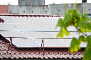 Photo collage of sunset and solar panel, photovoltaic