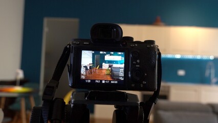 Man photographer taking pictures indoor in living room - real estate home photography and...