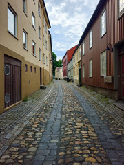 Quiet Cobblestone Lane with Rustic Buildings