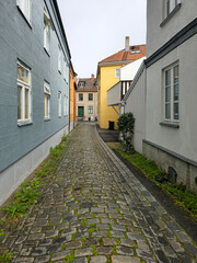 Quiet Cobblestone Lane with Rustic Buildings
