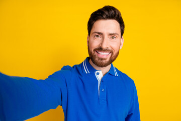 Photo portrait of pretty young male take selfie photo wear trendy blue outfit isolated on yellow color background