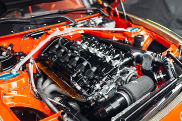 Open hood and engine bay of racing car