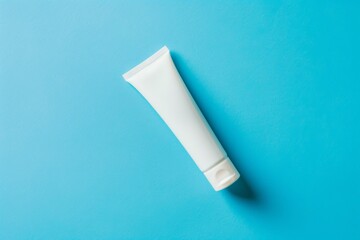White Cosmetic Tube on Vibrant Blue Background - Skincare Packaging Mockup