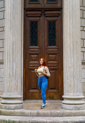 Beautiful woman posing at the gates of the Temple of Vesta in the eco-park of Buenos Aires -...