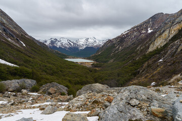 Beautiful view of the Emerald Lagoon with the Andes in the background from the snowy trail to the Albino Eye in Ushuaia - Argentina, Tierra del fuego