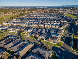 Aerial drone view of The Ponds in the North West of Sydney, NSW Australia on a sunny morning in June 2024 showing the densely packed homes and housing density 