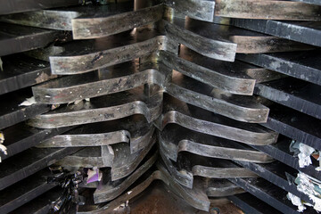 Underside of contra-shear cutter blades of industrial paper recycling shredder