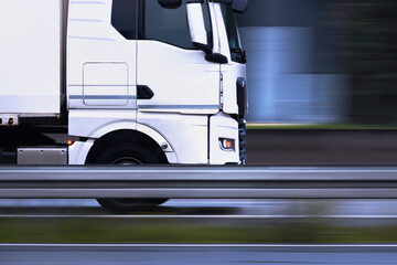an truck speeding on a highway blur