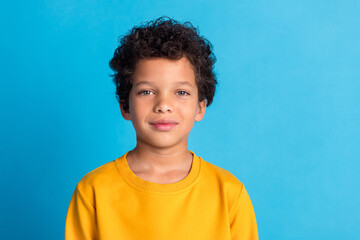 Photo of nice little schoolboy empty space wear pullover isolated on blue color background