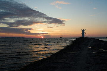 old fashioned windmill on the pier the coastline of usedom.