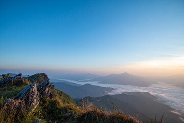 On the top of the mountain in the morning with beautiful mist.