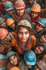 A group of women wearing hard hats and orange vests