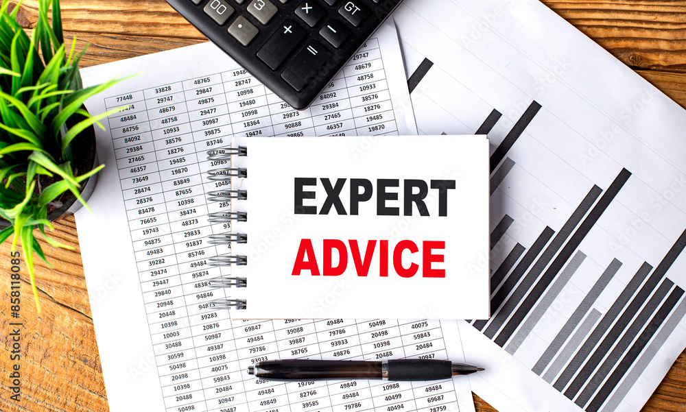 Aufkleber expert advice text on notebook on chart with calculator and pen