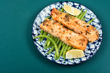 Baked salmon with green or bush beans.