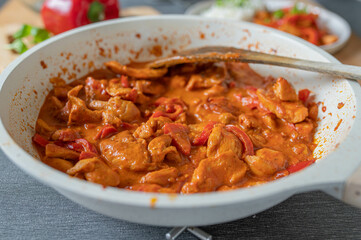 Creamy chicken with paprika, tomtato sauce. 