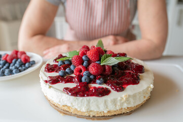 No bake Cheesecake with berry topping on kitchen counter