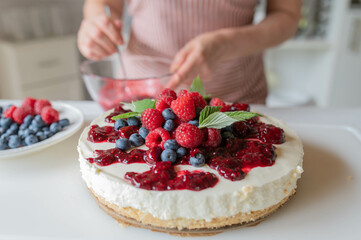 No bake Cheesecake with berry topping on kitchen counter