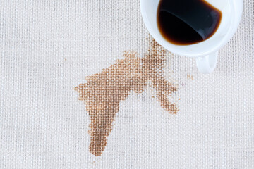Spilled coffee. A dirty coffee or tea stain on clothes or carpet.