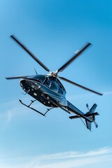 Private helicopter flying in clear blue sky. Business travel transportation, aviation and luxury tourism concept. Commercial chopper