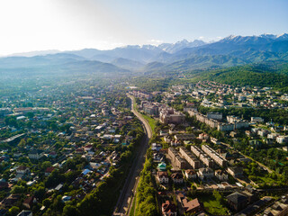 Aerial photography of the city of Almaty with a view of the mountains.