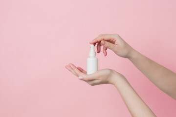 Glass unbranded white bottle with serum or essential oil with pipette. Natural moisturizing, nourishing cosmetics for skin, beauty and spa