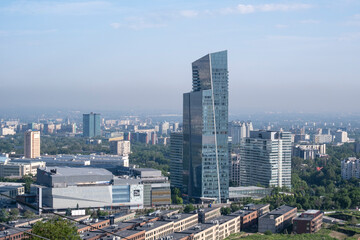 Fototapeta premium The architecture of the city of Almaty from the mountains, Old and new buildings of the city. Smog in the city. May 21, 2024 Almaty Kazakhstan