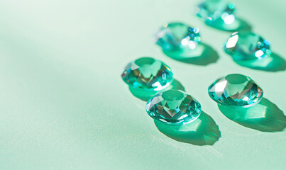 Fototapeta premium Minimalist Cyan Gemstones on Green Background