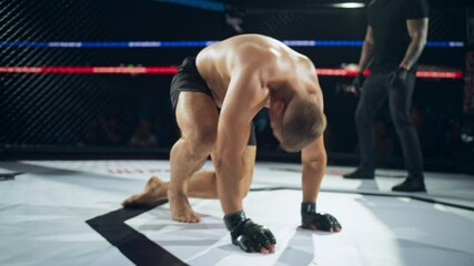 Professional Fighter Standing Up After a Successful Knockout by His Opponent. Portrait of a Fighter, Full of Adrenaline, Who Doesn't Retire, Still Hoping to Win the Championship