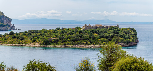 A view towards the Castle of Porto Palermo from Palermo Beach on the road to Sarandra, Albania in summertime