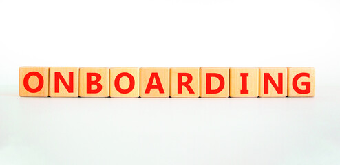 Onboarding success symbol. Concept word Onboarding on wooden blocks. Beautiful white background. Business onboarding success concept. Copy space.