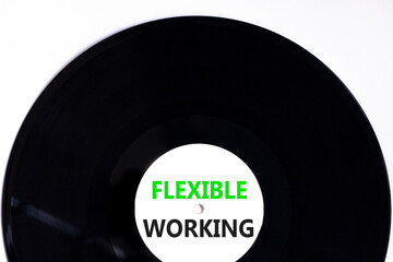 Flexible working symbol. Concept words Flexible working on beautiful white black vinyl disk....