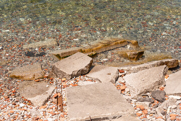 slabs of concrete or urban waste on a beach