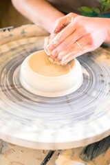 Clay being spun on pottery wheel