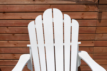 frontal view of a white wooden lounge chair (backing)