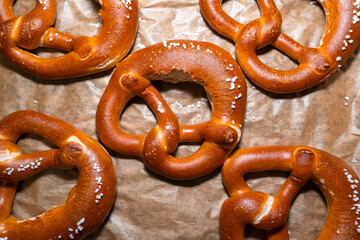 Crunchy baked pretzel on baking paper