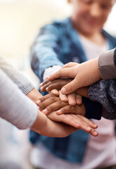 Stack of hands, education and kids with team, collaboration and unity at school. Diversity,...